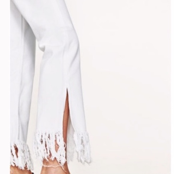 white flare fringe jeans
